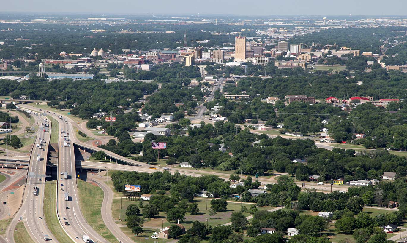 Aerial view of the highway and forests in Waco, Texas.